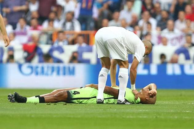 Vincent Kompany of Manchester City lies injured during the UEFA Champions League Semi Final 2nd leg match at the Santiago Bernabeu stadium. Photo credit should read: Philip Oldham Sportimage EDITORIAL USE ONLY. No use with unauthorised audio, video, data, fixture lists, club league logos or live services. Online in-match use limited to 120 images, no video emulation. No use in betting, games or single club league player publications.