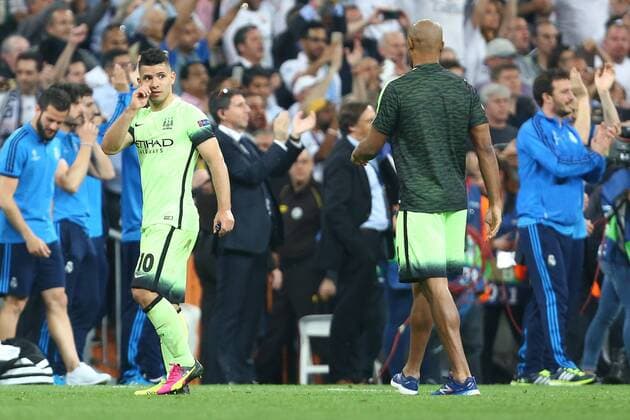 Vincent Kompany of Manchester City consoles Sergio Aguero during the UEFA Champions League Semi Final 2nd leg match at the Santiago Bernabeu stadium. Photo credit should read: Philip Oldham Sportimage EDITORIAL USE ONLY. No use with unauthorised audio, video, data, fixture lists, club league logos or live services. Online in-match use limited to 120 images, no video emulation. No use in betting, games or single club league player publications.