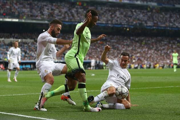 Fußball, CL, Real Madrid - Manchester City Lucas Vazquez of Real Madrid tackles Raheem Sterling of Manchester City during the UEFA Champions League Semi Final 2nd leg match at the Santiago Bernabeu stadium. Photo credit should read: Philip Oldham Sportimage EDITORIAL USE ONLY. No use with unauthorised audio, video, data, fixture lists, club league logos or live services. Online in-match use limited to 120 images, no video emulation. No use in betting, games or single club league player publications.