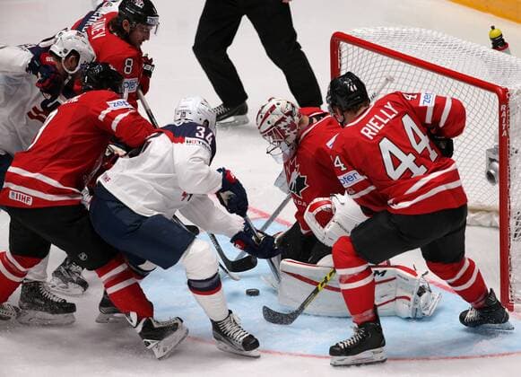 ST. PETERSBURG, RUSSIA. MAY 6, 2016. Canada s Morgan Rielly, goalie Cam Talbot defend against the United States Auston Matthews (R-L) in their 2016 IIHF World Championship WM Weltmeisterschaft Preliminary Round Group B Ice hockey Eishockey match at the Yubileyny Sports Palace. Sergei Savostyanov TASS  TS021D1D