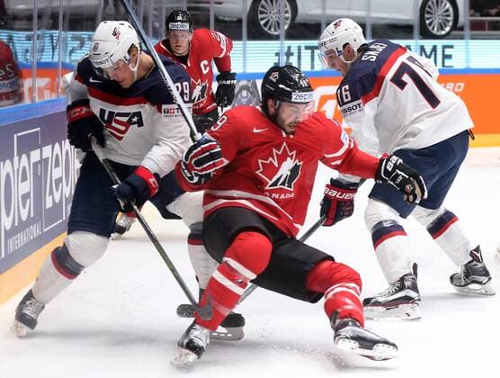 ST. PETERSBURG, RUSSIA. MAY 6, 2016. United States Jake McCabe (L), Brady Skjei (R) and Canada s Derick Brassard (C) fight for the puck in their 2016 IIHF World Championship WM Weltmeisterschaft Preliminary Round Group B Ice hockey Eishockey match at the Yubileyny Sports Palace. Alexander Demianchuk TASS  TS021D45