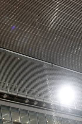A cascade of water seeps through the roof of the Principal Court on the Caja Magica (Magic Box) during Madrid Open Tennis 2016 match.May, 6, 2016.  (20160506154)