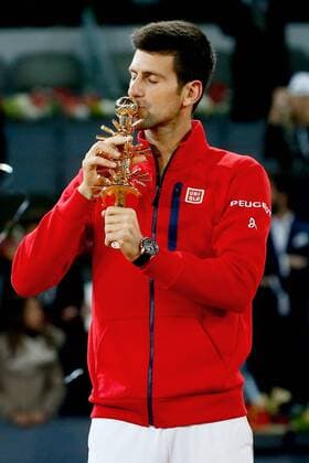 Serbian tennis player Novak Djokovic celebrates with the trophy his victory 6-2, 3-6 and 6-3 against Scottish Andy Murray during their Mutua Madrid Open male final match played at the Caja Magica tennis complex in Madrid, Spain, on 08 May 2016. Novak Djokovic vs Andy Murray !ACHTUNG: NUR REDAKTIONELLE NUTZUNG!  20160508-635983396983232025