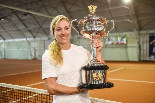 ANGELIQUE KERBER presents the Cup she won at Australian Open ANGELIQUE KERBER presents the Cup she won at Australian Open durng a meetin with her fans on May 6, 2016 at a Tennis Academy she owns in Puszczykowo, Poland.  EN_01211399_0002