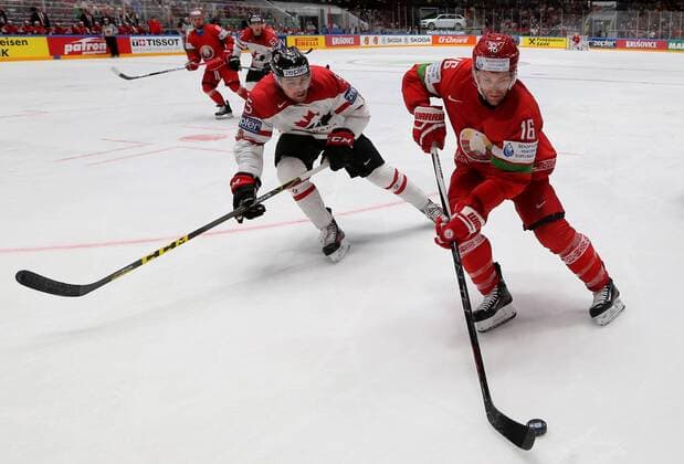 ST. PETERSBURG, RUSSIA. MAY 9, 2016. Canada s Cody Ceci (L) and Belarus Goeff Paltt fight for the puck in their 2016 IIHF World Championship WM Weltmeisterschaft Preliminary Round Group B Ice hockey Eishockey match at the Yubileyny Sports Palace. Team Canada won the game 8-0. Alexander Demianchuk TASS  TS0223CF