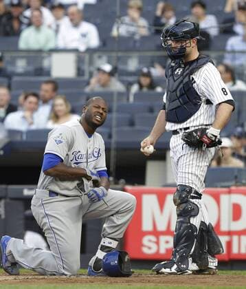 Kansas City Royals Lorenzo Cain reacts after getting hit by a pitch in the first inning against the New York Yankees at Yankee Stadium in New York City on May 11, 2016.  NYP20160511115 JOHNxANGELILLO