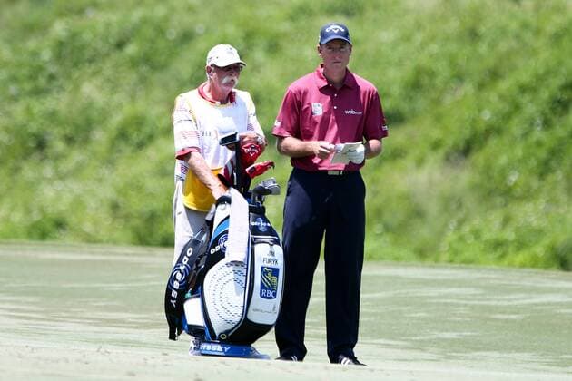 May 12, 2016 - Ponte Vedra Beach, Florida, United States - Jim Furyk (L) and his caddie Michael Thomas Fluff Cowan on the 7th fairway during the first round of The PLAYERS Championship at TPC Sawgrass. The PLAYERS Championship - Round 1 - ZUMAw109
