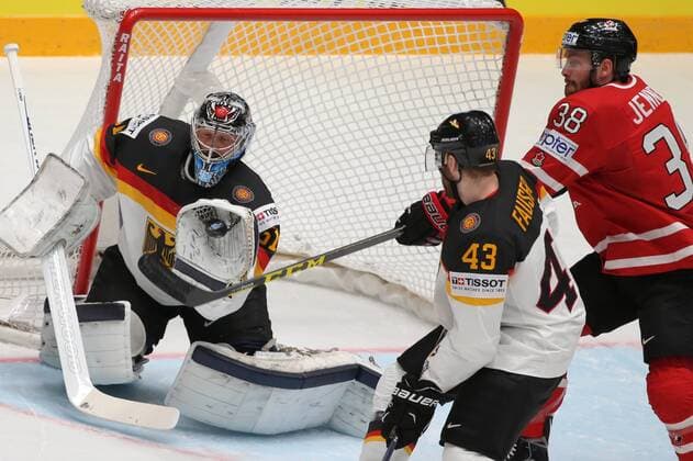 ST. PETERSBURG, RUSSIA. MAY 12, 2016. Germany s goalie Timo Pielmeier, Germany s Gerrit Fauser and Canada s Boone Jenner (L-R) in action in their 2016 IIHF World Championship WM Weltmeisterschaft Preliminary Round Group B Ice hockey Eishockey match at Yubileyny Sports Palace. Team Canada won the game 5:2. Sergei Savostyanov TASS  TS022A6D