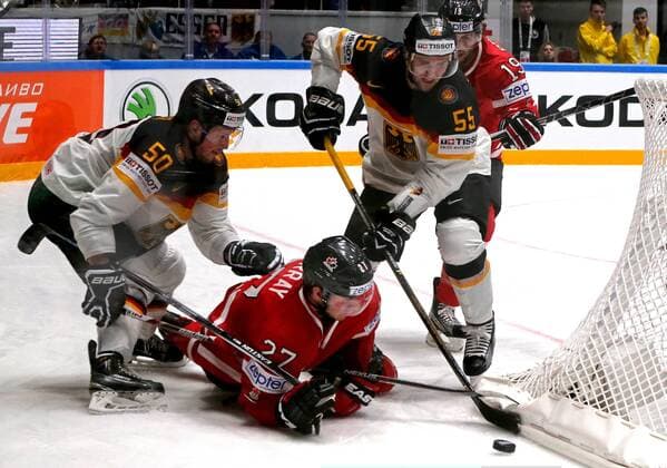 ST. PETERSBURG, RUSSIA. MAY 12, 2016. Germany s Patrick Hager, Canada s Ryan Murray, Germany s Felix Schutz and Canada s Derick Brassard (L-R) in action in their 2016 IIHF World Championship WM Weltmeisterschaft Preliminary Round Group B Ice hockey Eishockey match at Yubileyny Sports Palace. Team Canada won the game 5:2. Alexander Demianchuk TASS  TS022B54