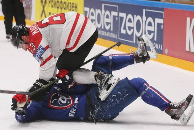 ST. PETERSBURG, RUSSIA. MAY 16, 2016. Canada s Brad Marchand (top) and France s Pierre-Edouard Bellemare in action in their 2016 IIHF World Championship WM Weltmeisterschaft Preliminary Round Group B Ice hockey Eishockey match at Yubileyny Sports Palace. The Canadian Team won the game 4:0. Sergei Savostyanov TASS  TS0233E0