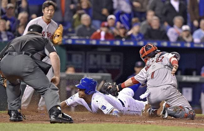 May 17, 2016 - Kansas City, MO, USA - The Kansas City Royals Salvador Perez scores before the tag from Boston Red Sox catcher Christian Vazquez on a bunt by Omar Infante and error on the throw to first by Boston Red Sox pitcher Koji Uehara in the eighth inning on Tuesday, May 17, 2016, at Kauffman Stadium in Kansas City, Mo. The Royals won, 8-4. Boston at Kansas City - ZUMAm67_