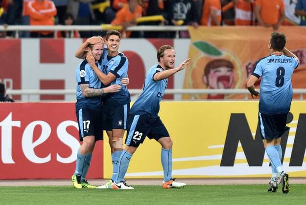 (160518) -- JINAN, May 18, 2016 -- David Carney (1st L) of Australia s Sydney FC celebrates with his teammates after scoring during the first round of 1 8 finals against China s Shangdong Luneng FC at the 2016 AFC Champions League in Jinan, capital of east China s Shandong Province, May 18, 2016. The match ended in a 1-1 draw. ) (SP)CHINA-JINAN-AFC CHAMPIONS LEAGUE 2016-SHANGDONG LUNENG FC VS SYDNEY FC (CN) XuxSuhui 