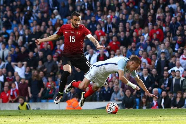 Mehmet Topal of Turkey fouls Jamie Vardy of England to give away a penalty during the International Friendly Länderspiel match at the Etihad Stadium. Photo credit should read: Philip Oldham Sportimage EDITORIAL USE ONLY. No use with unauthorised audio, video, data, fixture lists, club league logos or live services. Online in-match use limited to 120 images, no video emulation. No use in betting, games or single club league player publications.