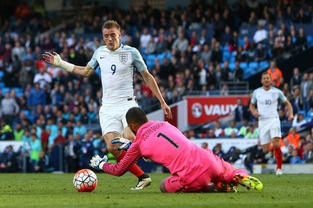 Jamie Vardy of England and Volkan Babacan of Turkey contest a loose ball during the International Friendly Länderspiel match at the Etihad Stadium. Photo credit should read: Philip Oldham Sportimage EDITORIAL USE ONLY. No use with unauthorised audio, video, data, fixture lists, club league logos or live services. Online in-match use limited to 120 images, no video emulation. No use in betting, games or single club league player publications.