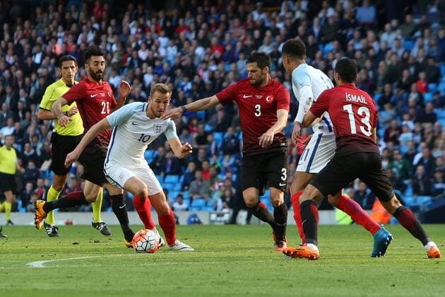 22.05.2016. Etihad Stadium, Manchester, England. International football friendly match, England versus Turkey. Harry Kane of England evades the tackle of Hakan Balta of Turkey. xDavidxBlunsdenx  ActionPlus11740509