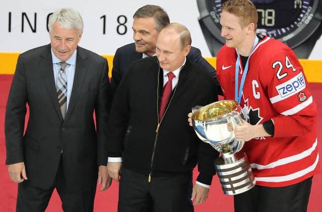Vice-president of the International Ice hockey Eishockey Federation Canadian Bob Nicholson, President of Russia Vladimir Putin and the head of the International Ice Hockey Federation Rene Fasel (left to right) at the awards ceremony after the final match of the World Hockey Championship between the teams of Finland and Canada in the sports complex VTB Ice Palace