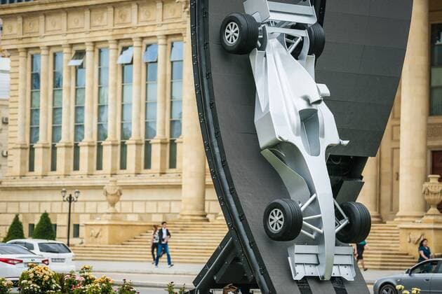 Baku: A silver car advertises A silver car advertises the first Baku Grand Prix background the Supreme Court.  AzizxKarimov