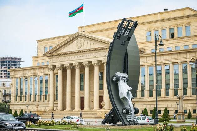 Baku: A silver car advertises A silver car advertises the first Baku Grand Prix background the Supreme Court.  AzizxKarimov
