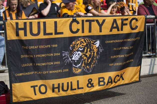 Football - 2016 Championship Play-Off Final - Hull vs. Sheffield Wednesday. Hull City fans display a flag picturing their recent history at Wembley Stadium COLORSPORT DANIEL BEARHAM  hul_she