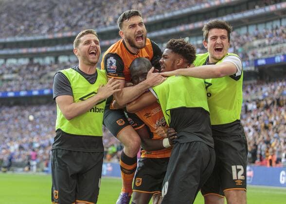 Football - 2016 Championship Play-Off Final - Hull vs. Sheffield Wednesday. Mohamed Diame of Hull City is mobbed by his fellow players after opening the scoring at Wembley Stadium COLORSPORT DANIEL BEARHAM  hul_she