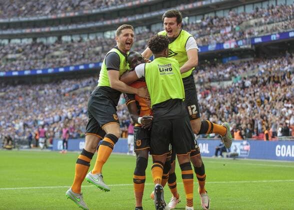 Football - 2016 Championship Play-Off Final - Hull vs. Sheffield Wednesday. Mohamed Diame of Hull City is mobbed by his fellow players after opening the scoring at Wembley Stadium COLORSPORT DANIEL BEARHAM  hul_she