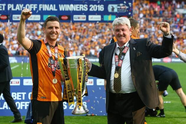 Hull s manager, Steve Bruce celebrates promotion with the cup during the Skybet Championship Play Off Final match at Wembley Stadium. Photo credit should read: Philip Oldham Sportimage EDITORIAL USE ONLY. No use with unauthorised audio, video, data, fixture lists, club league logos or live services. Online in-match use limited to 120 images, no video emulation. No use in betting, games or single club league player publications.