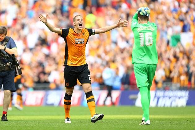 Hull s Michael Dawson celebrates promotion during the Skybet Championship Play Off Final match at Wembley Stadium. Photo credit should read: Philip Oldham Sportimage EDITORIAL USE ONLY. No use with unauthorised audio, video, data, fixture lists, club league logos or live services. Online in-match use limited to 120 images, no video emulation. No use in betting, games or single club league player publications.