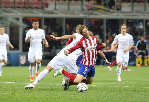 Fernando Torres of Atletico Madrid is brought down for a penalty by Pepe of Real Madrid during the UEFA Champions League Final match at the Giuseppe Meazza Stadium, Milan, Italy. Photo credit should read: David Klein Sportimage EDITORIAL USE ONLY. No use with unauthorised audio, video, data, fixture lists, club league logos or live services. Online in-match use limited to 120 images, no video emulation. No use in betting, games or single club league player publications.