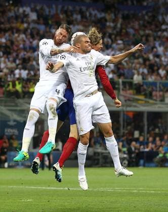 Sergio Ramos and Pepe of Real Madrid combine to keep out Fernando Torres of Atletico Madrid during the UEFA Champions League Final match at the Giuseppe Meazza Stadium, Milan, Italy. Photo credit should read: David Klein Sportimage EDITORIAL USE ONLY. No use with unauthorised audio, video, data, fixture lists, club league logos or live services. Online in-match use limited to 120 images, no video emulation. No use in betting, games or single club league player publications.