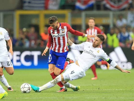 Sergio Ramos of Real Madrid makes a last chance tackle on Yannick Carrasco of Atletico Madrid during the UEFA Champions League Final match at the Giuseppe Meazza Stadium, Milan, Italy. Photo credit should read: David Klein Sportimage EDITORIAL USE ONLY. No use with unauthorised audio, video, data, fixture lists, club league logos or live services. Online in-match use limited to 120 images, no video emulation. No use in betting, games or single club league player publications.