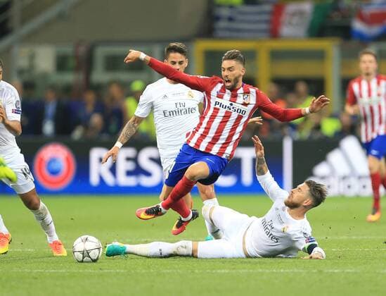 Sergio Ramos of Real Madrid makes a last chance tackle on Yannick Carrasco of Atletico Madrid during the UEFA Champions League Final match at the Giuseppe Meazza Stadium, Milan, Italy. Photo credit should read: David Klein Sportimage EDITORIAL USE ONLY. No use with unauthorised audio, video, data, fixture lists, club league logos or live services. Online in-match use limited to 120 images, no video emulation. No use in betting, games or single club league player publications.