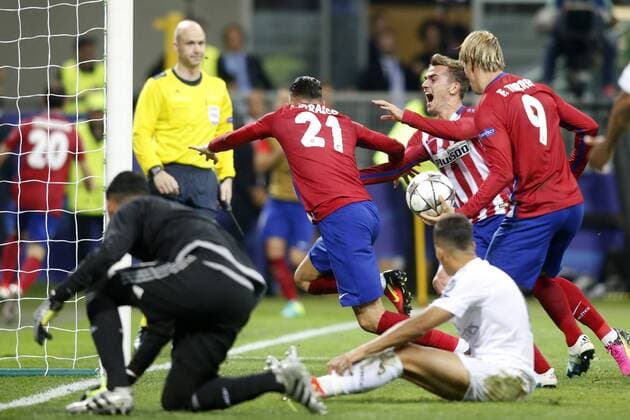Atletico de Madrid s Yannick Ferreira Carrasco, Antoine Griezmann and Fernando Torres celebrate goal during UEFA Champions League 2015 2016 Final match.May 28,2016.  (2016052826)