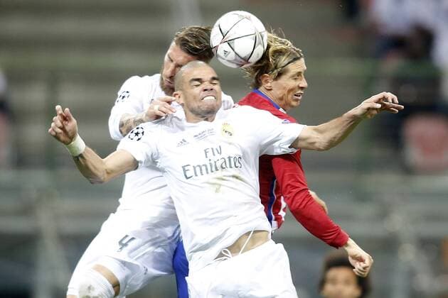 Real Madrid s Sergio Ramos (l) and Pepe (c) and Atletico de Madrid s Fernando Torres during UEFA Champions League 2015 2016 Final match.May 28,2016.  (20160528126)