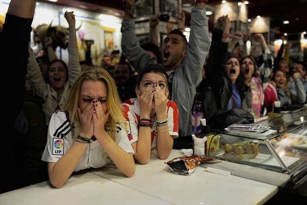 May 28, 2016 - Madrid, Spain - Fans of Atletico and Real Madrid react in the center of the Madrid, Spain, on May 28, 2016 during the final of the UEFA Champions League at Stadio Giuseppe Meazza on May 28, 2016 in Milan, Italy. Atletico And Real Fans Watch The Champions League Final In Madrid  - ZUMAn230