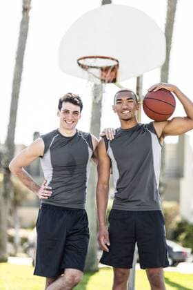 Portrait of two smiling young men on outdoor basketball court model released Symbolfoto  LEF000116