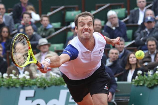 Richard Gasquet of France hits a shot during his French Open men s quarterfinal match against Andy Murray of the United Kingdom at Roland Garros in Paris on June 1, 2016.  PAR20160601736 DAVIDxSILPA