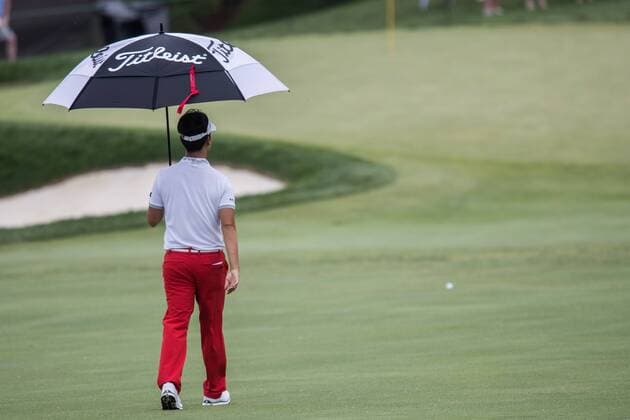 June 4, 2016 - Dublin, Ohio, U.S - Kevin Na walks to the 13th green in the rain during the third round of The Memorial Tournament at Muirfield Village Golf Club, Dublin, Ohio. Golf 2016 - The Memorial Tournament - Third Round - ZUMAs304