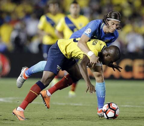 Brazil defender Filipe Luis (6) tackles Ecuador forward Enner Valencia (13) to the ground in the second half at COPA America Centenario at the Rose Bowl in Pasadena, California on June 4, 2016. Brazil and Ecuador played to a 0-0 tie.  LAP20160604613 ALEXxGALLARDO