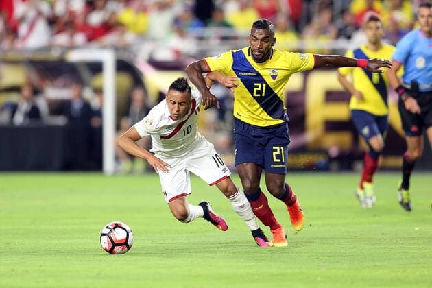 Copa America, Ecuador - Peru 08 June 2016: Peru midfielder Christian Cueva 10 is knocked down by Ecuador defender Gabriel Achilier 21 during the first half of the Copa America Centanario game at University of Phoenix Stadium in Glendale, Az. SOCCER: JUN 08 Copa America Centenario - Ecuador v Peru Icon3171606080553 EDITORIAL USE ONLY