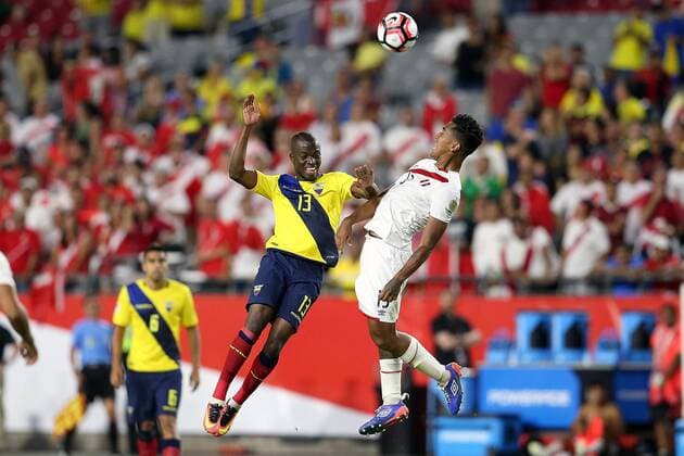 Copa America, Ecuador - Peru 08 June 2016: Peru midfielder Renato Tapia 13 and Ecuador forward Enner Valencia 13 go to head the ball during the second half of the Copa America Centanario game at University of Phoenix Stadium in Glendale, Az. The game ended in a 2-2 draw. SOCCER: JUN 08 Copa America Centenario - Ecuador v Peru Icon3171606081390 EDITORIAL USE ONLY