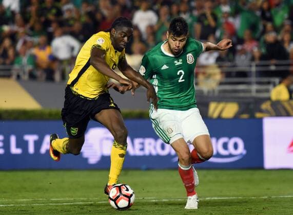 Mexico defender Nestor Araujo (2) tries to stop a breakaway by Jamaica forward Clayton Donaldson, left, during the second half of a 2016 Copa America Centenario Group A match at the Rose Bowl in Pasadena, California, on June 9, 2016. Mexico defeated Jamaica 2-0.  LAP20160609621 MICHAELxOWENxBAKER