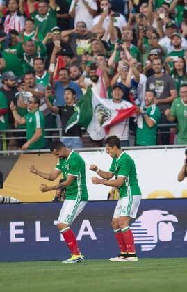 Mexico s Javier Chicharito Hernandez (R) celebrates after scoring during the Copa America Centenario tournament Group C football match between Mexico and Jamaica in Pasadena, California, the United States, on June 9, 2016. ) (SP)U.S.-PASADENA-COPA AMERICA-GROUP C-MEX VS JAM YangxLei 