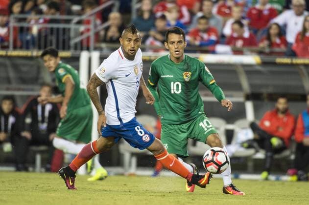 June 10, 2016 - Foxborough, Massachusetts, U.S - Chile midfielder ARTURO VIDAL (8) crosses the ball infant of Bolivia midfielder JHASMANI CAMPOS (10) during the Copa America Centenario football tournament at Gillette Stadium in Foxborough, MA. Soccer 2016 - Copa America Centenario Uruguay vs. Venezuela - ZUMAs192