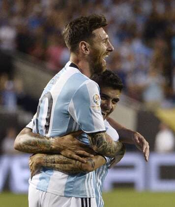 Argentina midfielder Lionel Messi (L) and midfielder Ever Banega celebrate Messi s second goal on a free kick during the second half of a 2016 Copa America Centenario Group D match against Panama at Soldier Field in Chicago on June 10, 2016. Argentina defeated Panama 5-0.  CHI2016061042 BRIANxKERSEY
