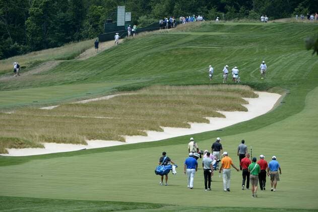 Golfers walk on the third fairway near the Church Pews bunkers during a practice round prior to the start of the 2016 U.S. Open at Oakmont Country Club in Oakmont, Pennsylvania on June 15, 2016.  PIT20160615405 PATxBENIC