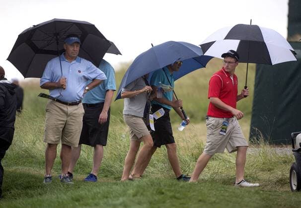 Golf, US Open Patrons leave the course during a rain delay in the first round of the 2016 U.S. Open at Oakmont Country Club in Oakmont, Pennsylvania on June 15, 2016.  OAK20160616303 KEVINxDIETSCH