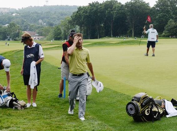 Andrew Landry, of Austin, Texas, walks off the ninth hole with a birdie putt left as play was suspended during first round of the U.S. Open golf championship at Oakmont Country Club near Pittsburgh, Pennsylvania on Thursday, June 16, 2016. Landry started on the back nine so he was on his final hole. He is the leader at three under par after play was suspended for the day due to rain during the first round.  OAK20160616124 PATxBENIC