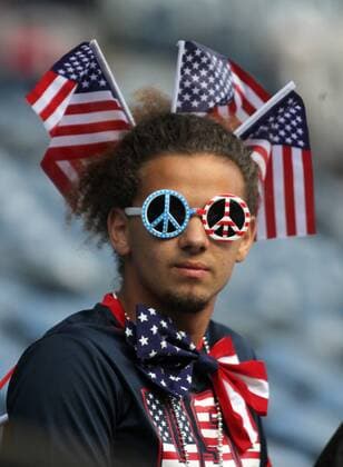 A USA fan wears flags and peace sign glasses before the game against Ecuador in a 2016 Copa America Centenario soccer quarterfinals at CenturyLink Field in Seattle, Washington on June 16, 2016. USA beat Ecuador 2-1 to advance to the semi-finals.  SEA2016061607 JIMxBRYANT