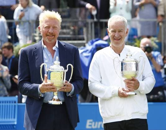17.06.2016. Queens Club, London, England. Aegon Queens Tennis Championships Day Five. The tournament celebrated its four time champions on Centre Court this afternoon with presentations of quarter sized trophies to four-time champions Boris Becker, John McEnroe, Roy Emerson and Lleyton Hewitt. Old foes, Becker and McEnroe pose with their trophies. xAlanxMartinx  ActionPlus11750717