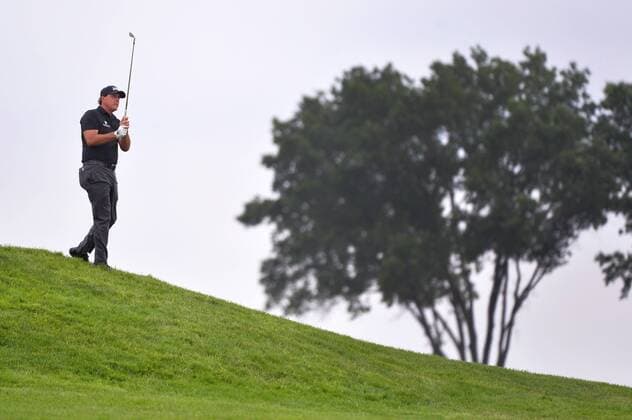 Phil Mickelson watches his fairway shot on the 10th hole at the 2016 U.S. Open at Oakmont Country Club in Oakmont, Pennsylvania on June 17, 2016.  OAK20160617302 KEVINxDIETSCH